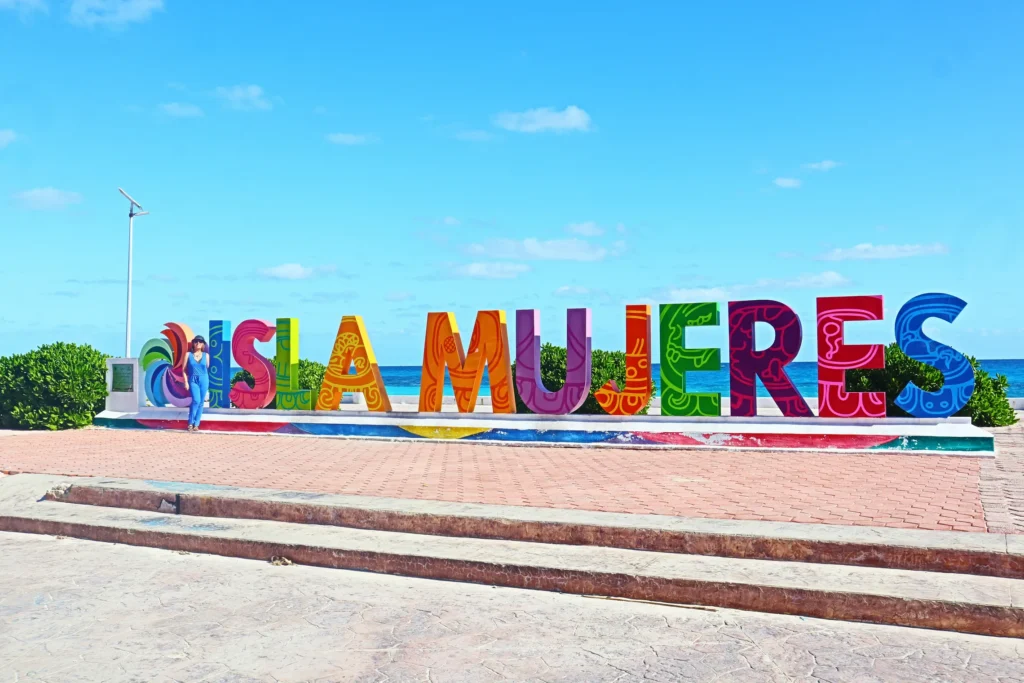 Large, colorful Isla Mujeres sign overlooking the ocean